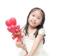 Cute asian little bridesmaid holding heart flower isolated Royalty Free Stock Photo
