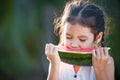 Cute asian little child girl eating watermelon fresh fruit Royalty Free Stock Photo