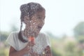 Cute asian little child girl helping parent to clean window Royalty Free Stock Photo