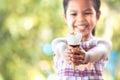 Cute asian little child girl holding delicious icecream cone Royalty Free Stock Photo