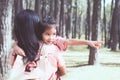 Cute asian little child girl hugging her mother with love Royalty Free Stock Photo