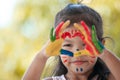 Cute asian little child girl with painted hands make heart shape Royalty Free Stock Photo