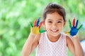 Cute asian little child girl with painted hands smiling with fun Royalty Free Stock Photo