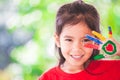 Cute asian little child girl with painted hands smiling Royalty Free Stock Photo