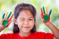 Cute asian little child girl with painted hands smiling Royalty Free Stock Photo