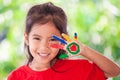 Cute asian little child girl with painted hands smiling Royalty Free Stock Photo