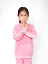 Cute asian little child girl in pink tracksuit or sport cloth with cross one `s arm for confident isolated on white background. Royalty Free Stock Photo