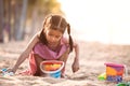 Cute asian little child girl play with sand on beach Royalty Free Stock Photo