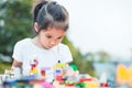 Cute asian little child girl playing with colorful toy blocks Royalty Free Stock Photo