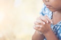 Cute asian little child girl praying with folded her hand Royalty Free Stock Photo