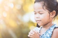 Cute asian little child girl praying with folded her hand Royalty Free Stock Photo