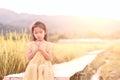 Cute asian little child girl praying with folded her hand