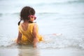 Cute asian little child girl sitting and playing on beach Royalty Free Stock Photo