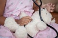 Cute asian little child girl with stethoscope playing doctor Royalty Free Stock Photo