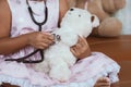 Cute asian little child girl with stethoscope playing doctor Royalty Free Stock Photo