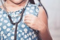 Cute asian little child girl with stethoscope playing doctor Royalty Free Stock Photo