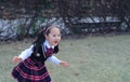 Cute Asian little beautiful girl run in the park Royalty Free Stock Photo