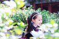 Little girl with lollipop Cute Asian little beautiful girl play at autumn in the city park Royalty Free Stock Photo