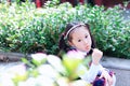 Little girl with lollipop Cute Asian little beautiful girl play at autumn in the city park Royalty Free Stock Photo