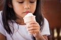 Cute asian little girl hand holding ice cream cone Royalty Free Stock Photo