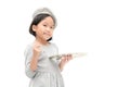 Cute asian little girl painter posing with a brush and palette. Royalty Free Stock Photo