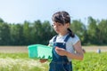 Cute asian little girl picking strawberry in the field at summer Royalty Free Stock Photo