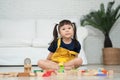 Cute asian little girl playing with colorful toy blocks, Kids play with educational toys at kindergarten or daycare. Creative Royalty Free Stock Photo