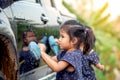 Cute asian little girl washing car Royalty Free Stock Photo