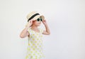 Cute asian little girl wearing sunglasses and straw hat isolated on white background with looking beside. Summer and fashion Royalty Free Stock Photo