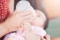 Cute asian newborn baby girl holding mother`s finger Royalty Free Stock Photo