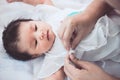 Cute asian newborn baby girl lying down on her bed Royalty Free Stock Photo