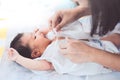 Cute asian newborn baby girl lying down on her bed Royalty Free Stock Photo