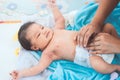 Cute asian newborn baby girl lying down on her bed Royalty Free Stock Photo