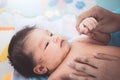 Cute asian newborn baby girl lying down on her bed Royalty Free Stock Photo