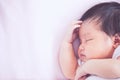 Cute asian newborn baby girl sleeping in bed Royalty Free Stock Photo