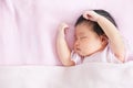 Cute asian newborn baby girl sleeping in bed Royalty Free Stock Photo