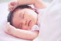 Cute asian newborn baby girl sleeping in bed Royalty Free Stock Photo