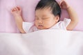 Cute asian newborn baby girl sleeping in bed Royalty Free Stock Photo