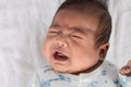 Asian newborn crying on white towel Royalty Free Stock Photo