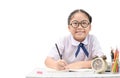 Cute asian student doing homework on table isolated Royalty Free Stock Photo