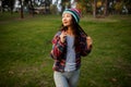 Cute Asian Teen Girl Smilling In Autumn Forest. Candid Woman In Hat Enjoying Autumn In The Forest . Royalty Free Stock Photo