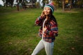 Cute Asian Teen Girl Smilling In Autumn Forest. Candid Woman In Hat Enjoying Autumn In The Forest . Royalty Free Stock Photo