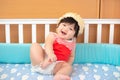 Cute Asian Thai Baby Girl in White Wood Crib Royalty Free Stock Photo