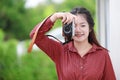 Cute Asian Thai teen girl enjoy with digital camera for hobby photographer