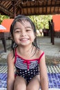 Cute asian toddlers twins portrait shot smiling while playing on waters of a swimming pool in a resort Royalty Free Stock Photo