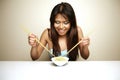 Cute Asian woman eating