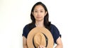 Cute Asian woman hide face behind hat. Introvert and antisocial