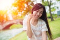 Cute asian woman smile with finger dimples cheek