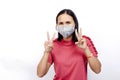 Cute asian woman wearing mask for protect Covid 19 or coronavirus and show fights hands gesture on white backgrounds Royalty Free Stock Photo