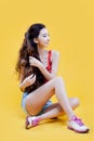 Cute asian young girl. Portrait on yellow background. Royalty Free Stock Photo